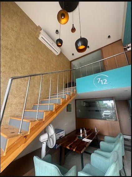 Interior staircase and seating at 7/12 Meeting Café